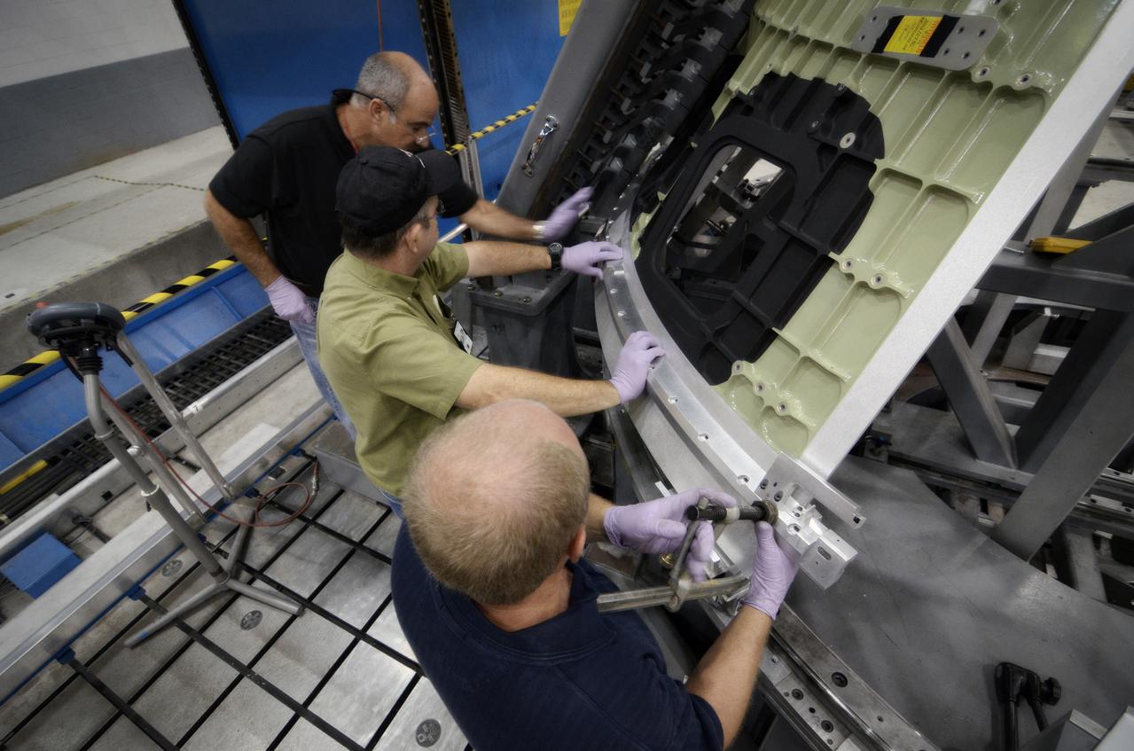 Technicians begin welding the Exploration Flight Test-1 (EFT-1) Orion pressure vessel at NASA’s Michoud Assembly Facility in New Orleans on Sept. 9, 2011. Orion’s pressure vessel is underlying frame of the crew module that will provide an air-tight, habitable space for astronauts on future missions to the Moon. Part of Batch image transfer from Flickr.