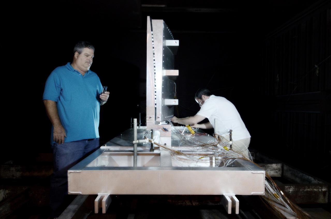 Technicians begin welding the Exploration Flight Test-1 (EFT-1) Orion pressure vessel at NASA’s Michoud Assembly Facility in New Orleans on Sept. 9, 2011. Orion’s pressure vessel is underlying frame of the crew module that will provide an air-tight, habitable space for astronauts on future missions to the Moon. Part of Batch image transfer from Flickr.