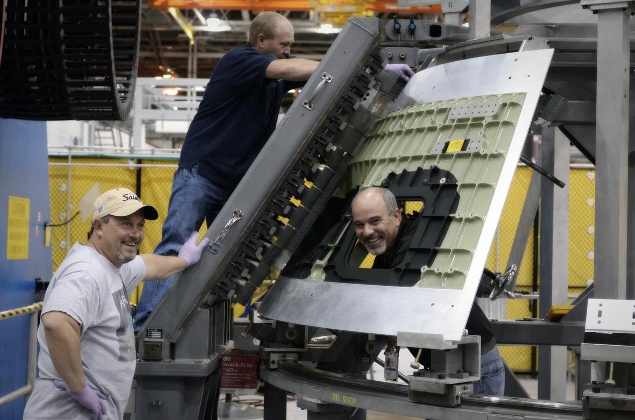 Technicians begin welding the Exploration Flight Test-1 (EFT-1) Orion pressure vessel at NASA’s Michoud Assembly Facility in New Orleans on Sept. 9, 2011. Orion’s pressure vessel is underlying frame of the crew module that will provide an air-tight, habitable space for astronauts on future missions to the Moon. Part of Batch image transfer from Flickr.