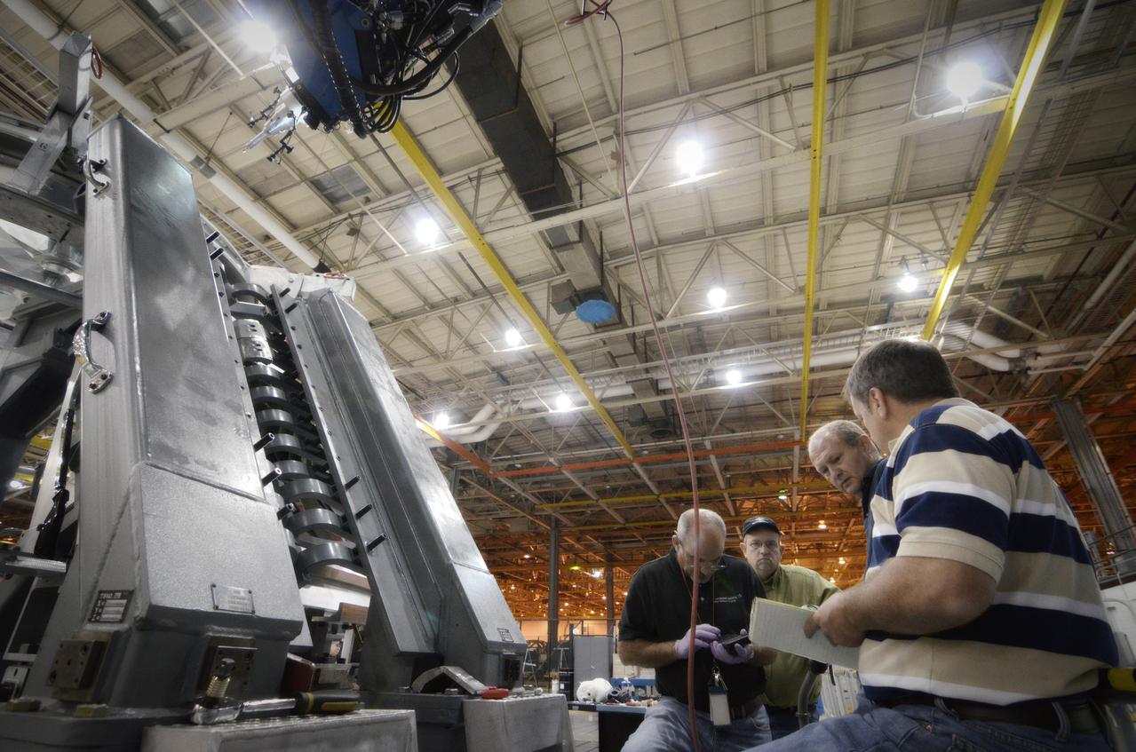 Technicians begin welding the Exploration Flight Test-1 (EFT-1) Orion pressure vessel at NASA’s Michoud Assembly Facility in New Orleans on Sept. 9, 2011. Orion’s pressure vessel is underlying frame of the crew module that will provide an air-tight, habitable space for astronauts on future missions to the Moon. Part of Batch image transfer from Flickr.