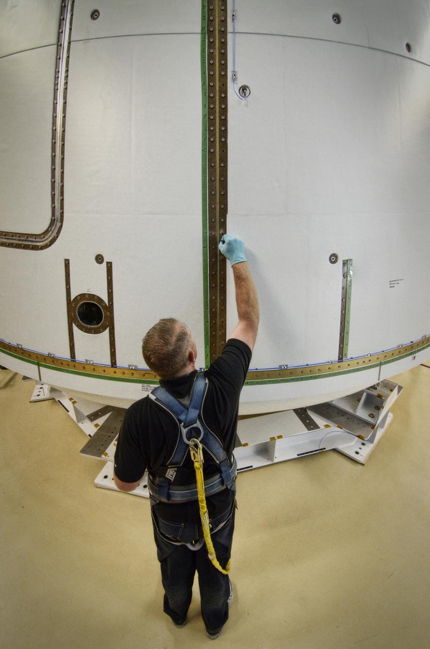 The Orion ground test vehicle is prepared for the Launch Abort Vehicle Configuration Test at Lockheed Martin's facilities in Denver on Sept. 15, 2011. For this test, the vehicle was covered with fillets and ogive panels that resemble the vehicle's launch configuration. The spacecraft underwent testing at sound pressure levels that emulate those experienced at launch and in the event an abort is needed to carry the crew to safety away from a potential problem on the launch pad or during ascent. Part of Batch image transfer from Flickr.