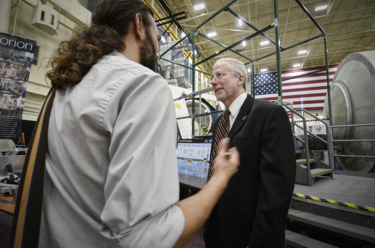 Orion Program Manager Mark Geyer tours the Orion mockups in Bldg. 9 at Johnson Space Center in Houston followed by a short Q&amp;A in front of the mockup on Sept. 26, 2011. . Part of Batch image transfer from Flickr. 