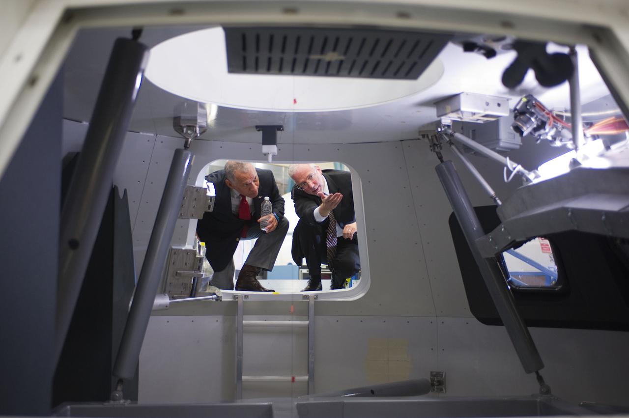 NASA Administrator Charlie Bolden, accompanied by JSC Director Mike Coats, tours the Orion mockups in Bldg. 9 at Johnson Space Center in Houston followed by a short Q&amp;A in front of the mockup on Sept. 26, 2011. Part of Batch image transfer from Flickr. 