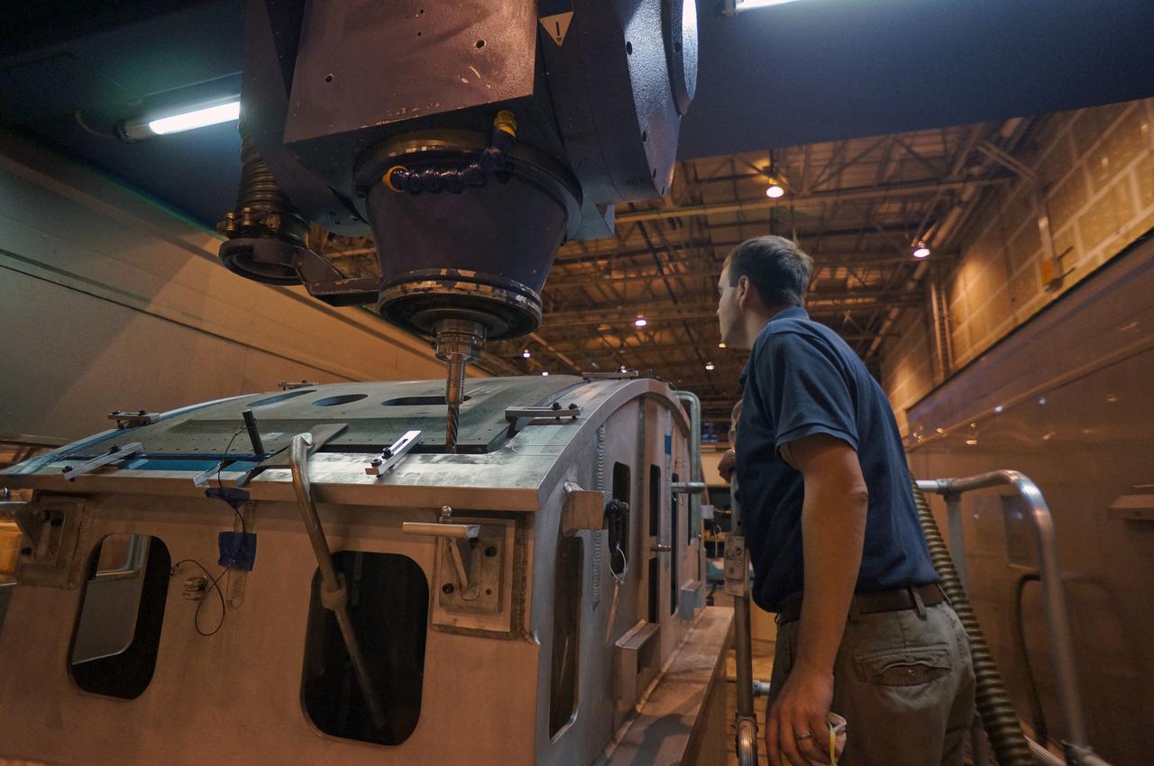 Composite crew module adapter (CMA) panels for the Exploration Flight Test-1 Orion are manufactured using computer numerical control (CNC) machining at NASA's Michoud Assembly Facility in New Orleans on Nov. 11, 2011. Part of Batch image transfer from Flickr.