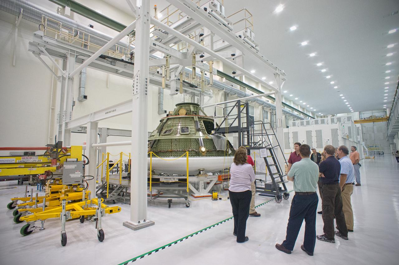 The Structural Passive Landing Attenuation for Survivability of Human Crew (SPLASH) project team from NASA’s Langley Research Center examines the Orion ground test article in the Operations and Checkout (O&amp;C) Building at Kennedy Space Center in Florida on Dec. 31, 2011. Part of Batch image transfer from Flickr. 
