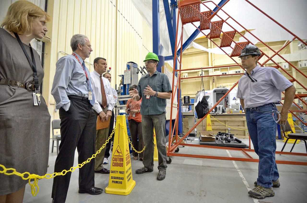 Astronaut Rex Walheim uses the Active Response Gravity Offload System (ARGOS) to perform early evaluations of the Orion Crew Survival System (OCSS) suit in Building 9 of Johnson Space Center in Houston on June 5, 2012. ARGOS is designed to simulate reduced gravity environments, such as lunar, Martian, or microgravity, using a system similar to an overhead bridge crane. Part of Batch image transfer from Flickr.