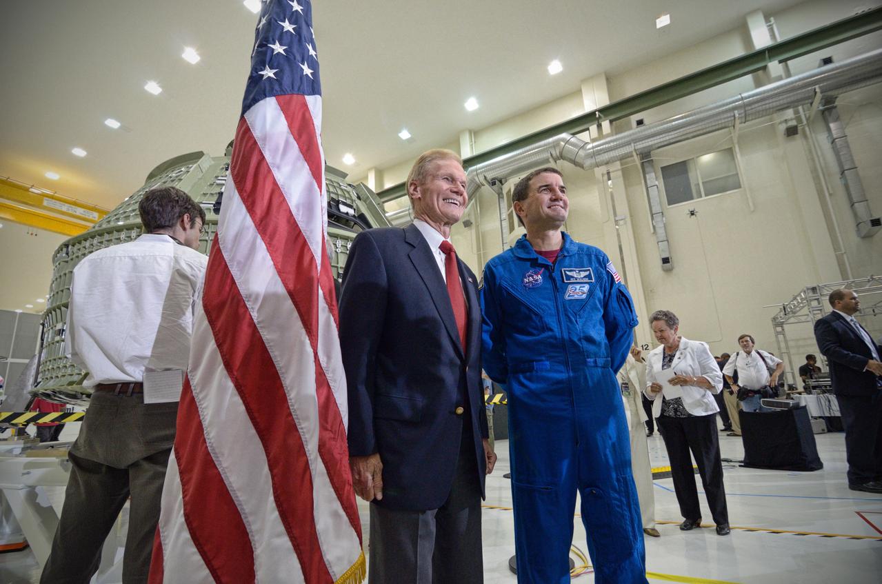 The Orion crew module pressure vessel for Exploration Flight Test-1 (EFT-1) is unveiled at a ceremony at the Operations and Checkout (O&amp;C) Building at NASA’s Kennedy Space Center in Florida on July 2, 2012. Astronaut Rex Walheim poses for photo. Part of Batch image transfer from Flickr. 