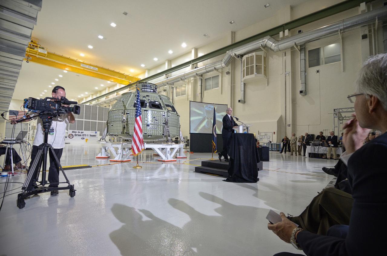 The Orion crew module pressure vessel for Exploration Flight Test-1 (EFT-1) is unveiled at a ceremony at the Operations and Checkout (O&amp;C) Building at NASA’s Kennedy Space Center in Florida on July 2, 2012. Orion Program Manager Mark Geyer is visible at podium. Part of Batch image transfer from Flickr. 