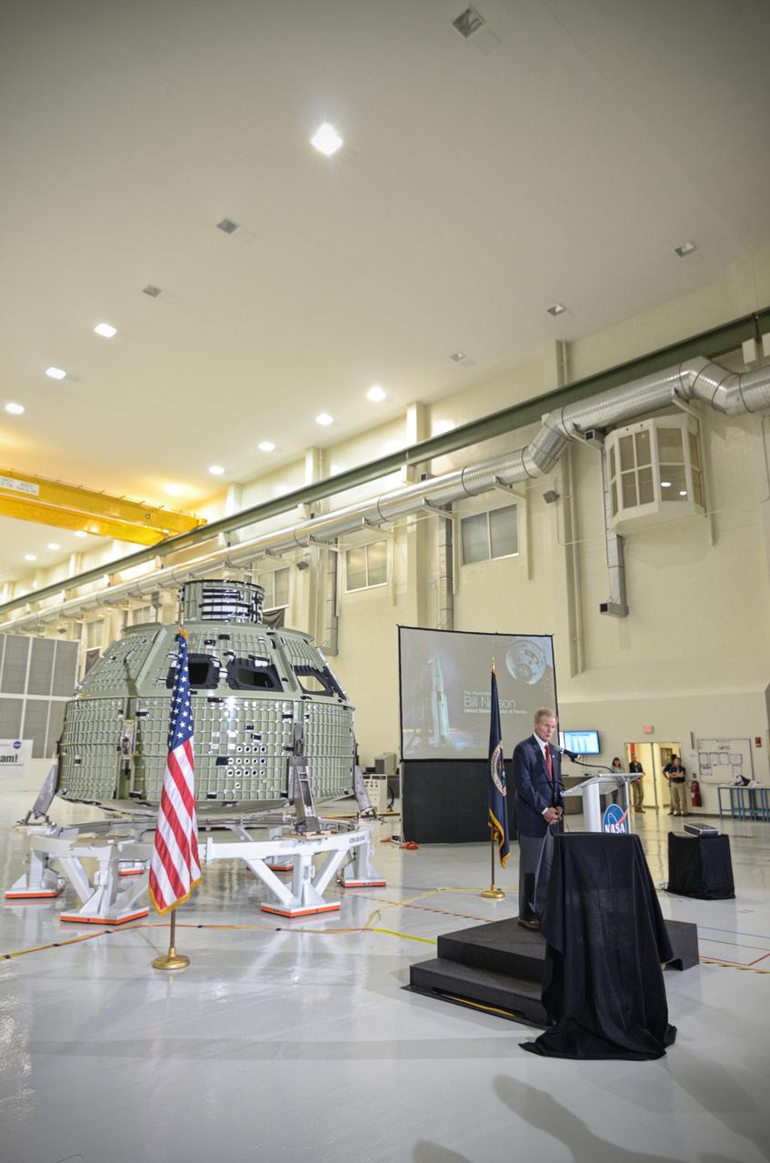 The Orion crew module pressure vessel for Exploration Flight Test-1 (EFT-1) is unveiled at a ceremony at the Operations and Checkout (O&amp;C) Building at NASA’s Kennedy Space Center in Florida on July 2, 2012. Orion Program Manager Mark Geyer is visible at podium. Part of Batch image transfer from Flickr. 