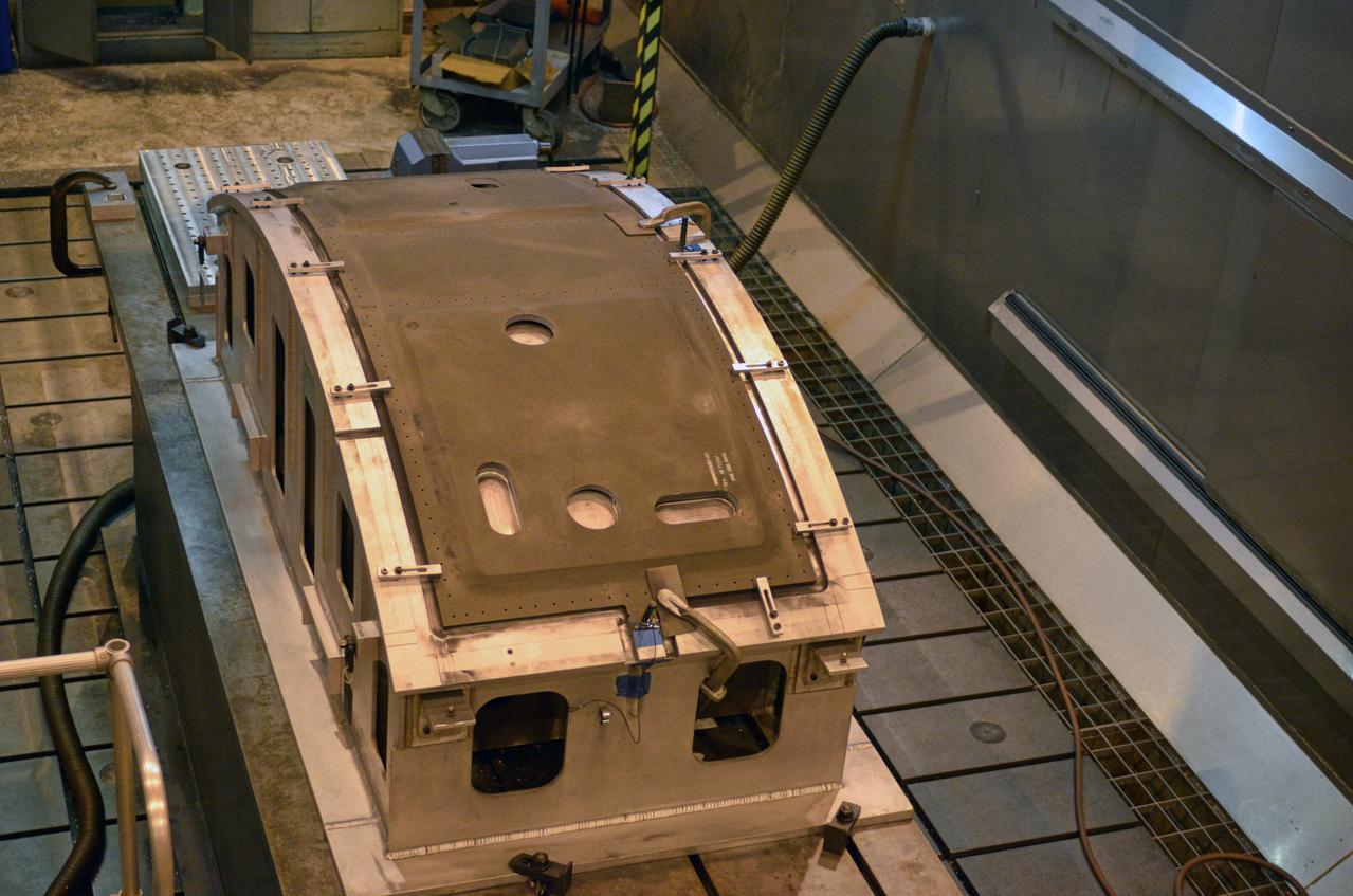 Technicians work on the composite crew module adapter (CMA) panels for the Exploration Flight Test-1 (EFT-1) Orion at NASA's Michoud Assembly Facility in New Orleans on Sept. 25, 2012. Part of Batch image transfer from Flickr.