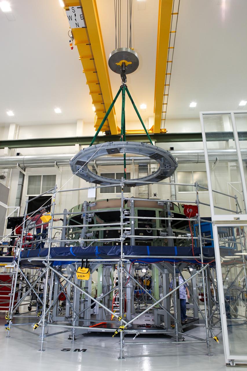 Technicians work on assembly of the Exploration Flight Test-1 (EFT-1) Orion service module mass simulator at the Operations and Checkout (O&C) Building at Kennedy Space Center on March 13, 2013. Part of Batch image transfer from Flickr.