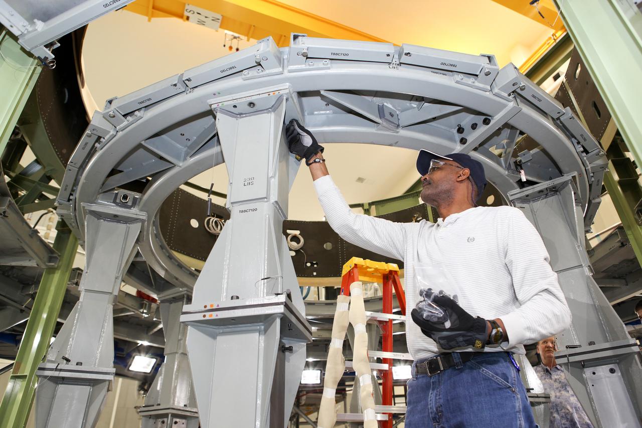 Technicians work on assembly of the Exploration Flight Test-1 (EFT-1) Orion service module mass simulator at the Operations and Checkout (O&amp;C) Building at Kennedy Space Center on March 13, 2013. Part of Batch image transfer from Flickr.