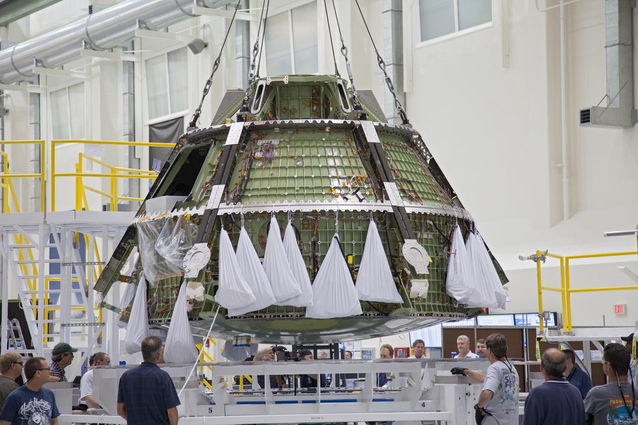 Technicians move the Exploration Flight Test-1 (EFT-1) Orion crew module pressure vessel in the Operations and Checkout (O&amp;C) Building at Kennedy Space Center on March 20, 2013. Part of Batch image transfer from Flickr.