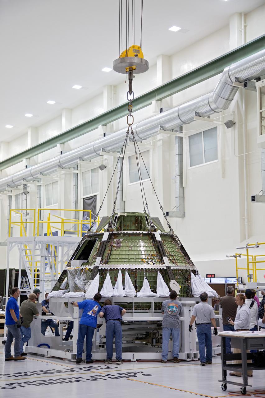 Technicians move the Exploration Flight Test-1 (EFT-1) Orion crew module pressure vessel in the Operations and Checkout (O&amp;C) Building at Kennedy Space Center on March 20, 2013. Part of Batch image transfer from Flickr.