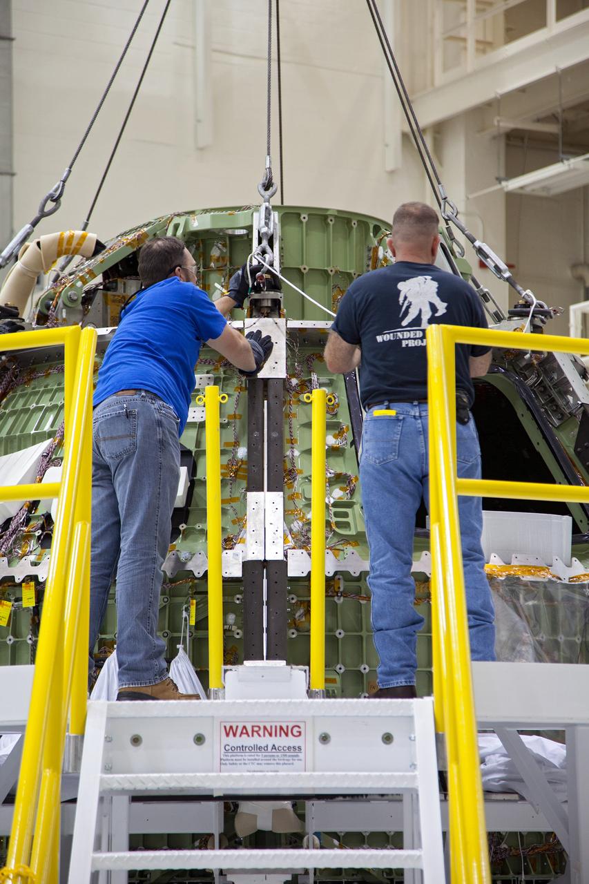 Technicians move the Exploration Flight Test-1 (EFT-1) Orion crew module pressure vessel in the Operations and Checkout (O&amp;C) Building at Kennedy Space Center on March 20, 2013. Part of Batch image transfer from Flickr.