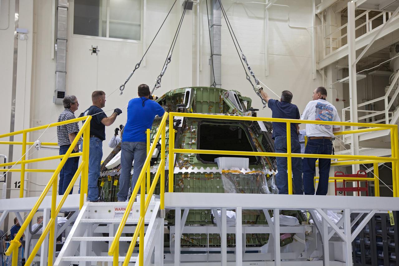Technicians move the Exploration Flight Test-1 (EFT-1) Orion crew module pressure vessel in the Operations and Checkout (O&amp;C) Building at Kennedy Space Center on March 20, 2013. Part of Batch image transfer from Flickr.