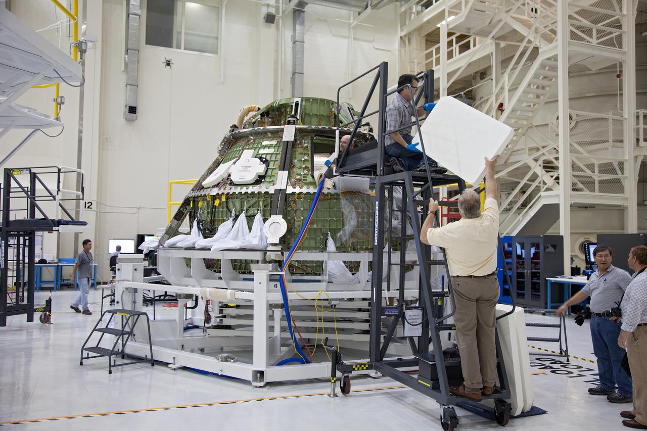 Technicians move the Exploration Flight Test-1 (EFT-1) Orion crew module pressure vessel in the Operations and Checkout (O&amp;C) Building at Kennedy Space Center on March 20, 2013. Part of Batch image transfer from Flickr.