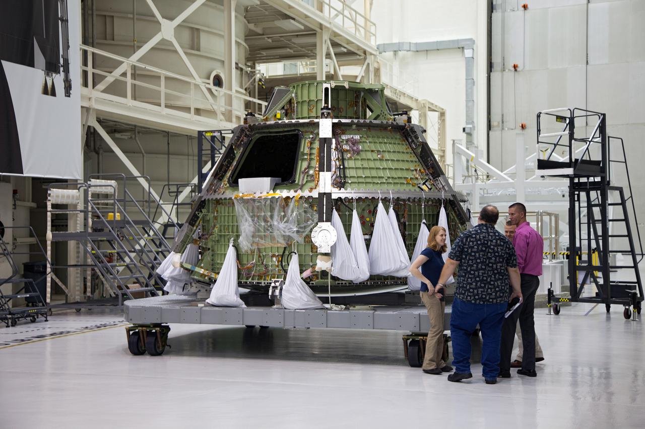 Technicians move the Exploration Flight Test-1 (EFT-1) Orion crew module pressure vessel in the Operations and Checkout (O&amp;C) Building at Kennedy Space Center on March 20, 2013. Part of Batch image transfer from Flickr.