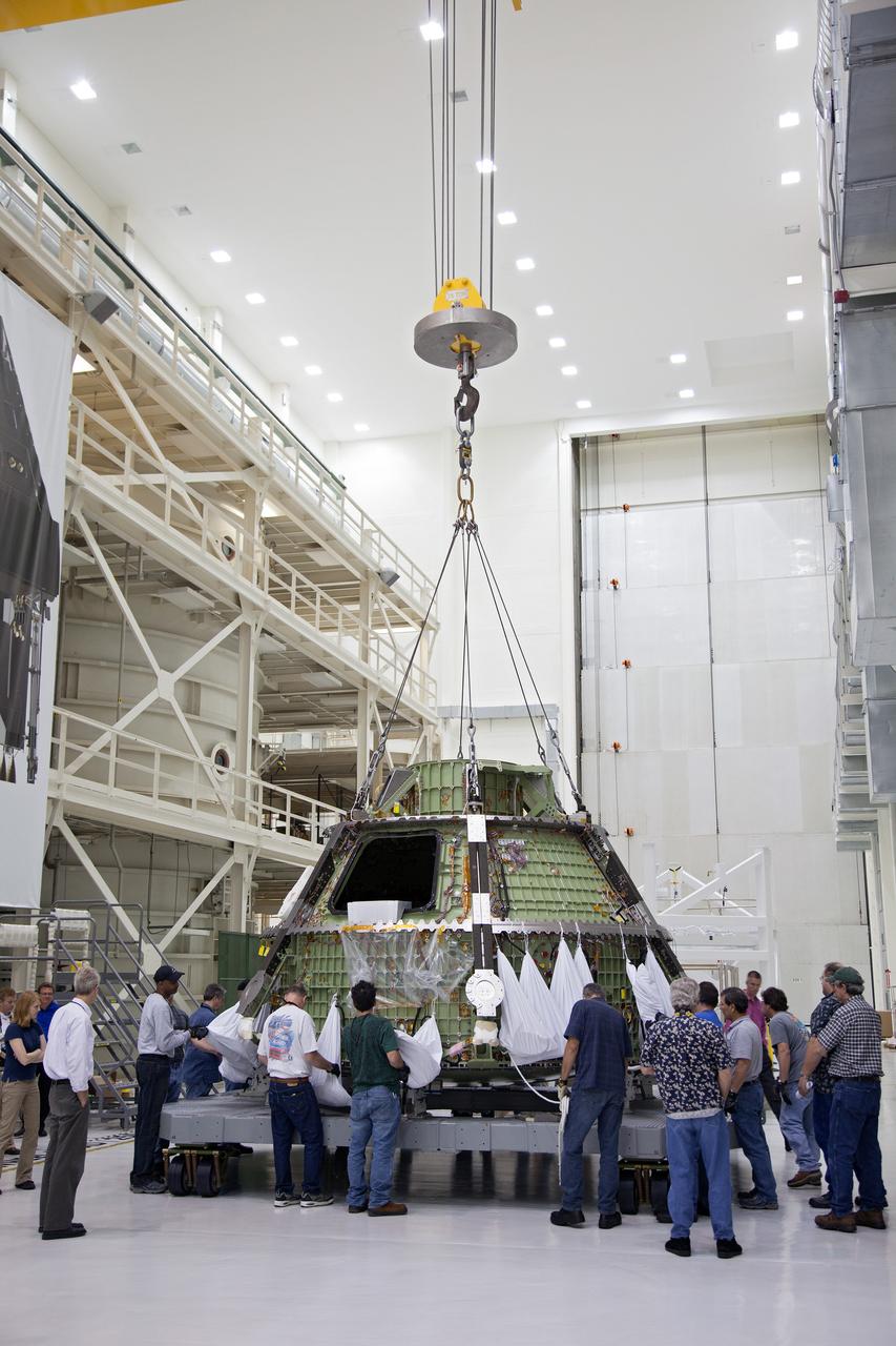 Technicians move the Exploration Flight Test-1 (EFT-1) Orion crew module pressure vessel in the Operations and Checkout (O&amp;C) Building at Kennedy Space Center on March 20, 2013. Part of Batch image transfer from Flickr.