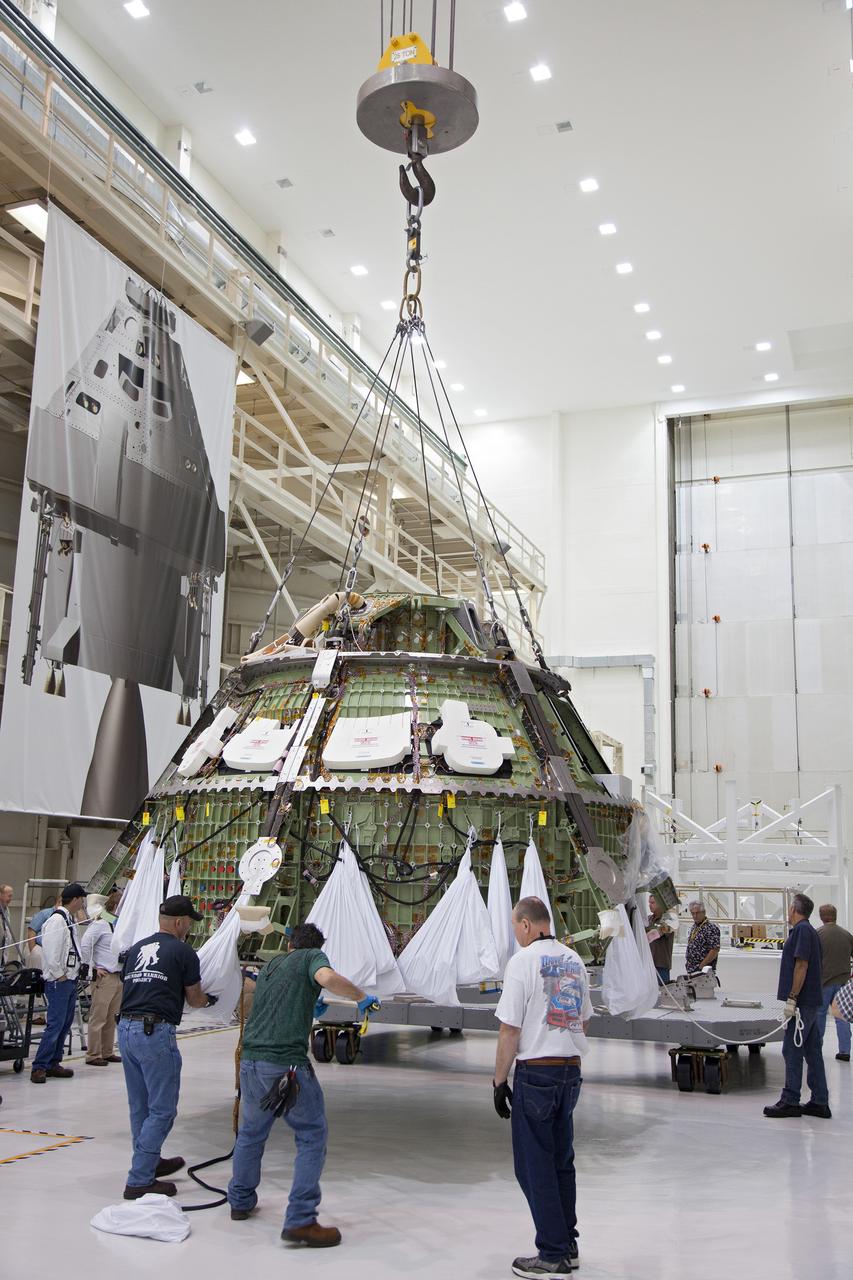 Technicians move the Exploration Flight Test-1 (EFT-1) Orion crew module pressure vessel in the Operations and Checkout (O&amp;C) Building at Kennedy Space Center on March 20, 2013. Part of Batch image transfer from Flickr.