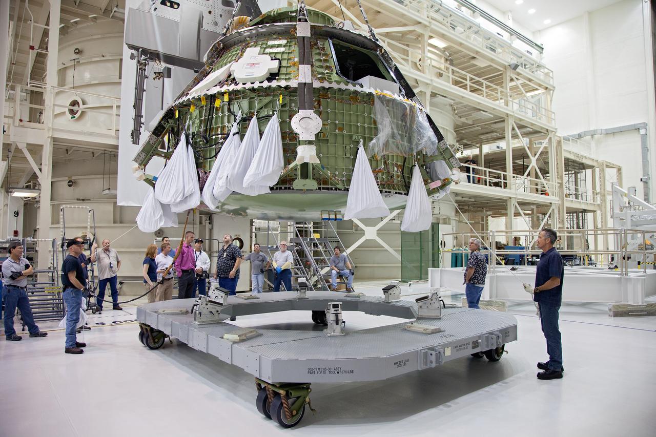 Technicians move the Exploration Flight Test-1 (EFT-1) Orion crew module pressure vessel in the Operations and Checkout (O&amp;C) Building at Kennedy Space Center on March 20, 2013. Part of Batch image transfer from Flickr.