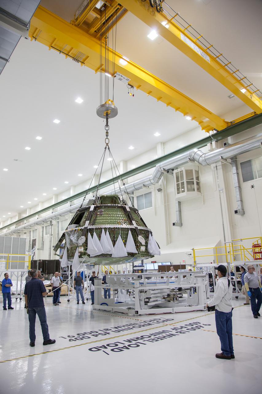 Technicians move the Exploration Flight Test-1 (EFT-1) Orion crew module pressure vessel in the Operations and Checkout (O&amp;C) Building at Kennedy Space Center on March 20, 2013. Part of Batch image transfer from Flickr.