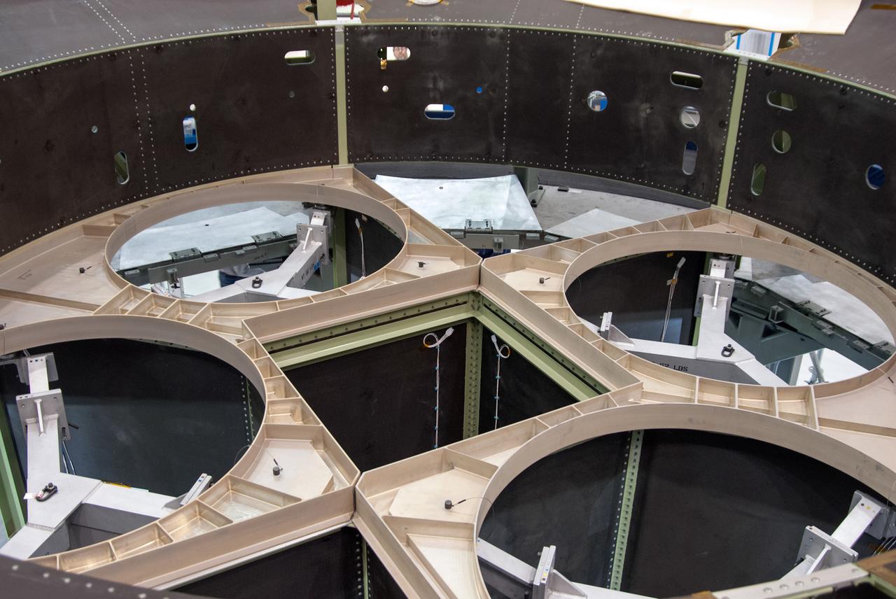 Technicians work on assembly of the Exploration Flight Test-1 (EFT-1) Orion service module mass simulator at the Operations and Checkout (O&C) Building at Kennedy Space Center on March 22, 2013. Part of Batch image transfer from Flickr.