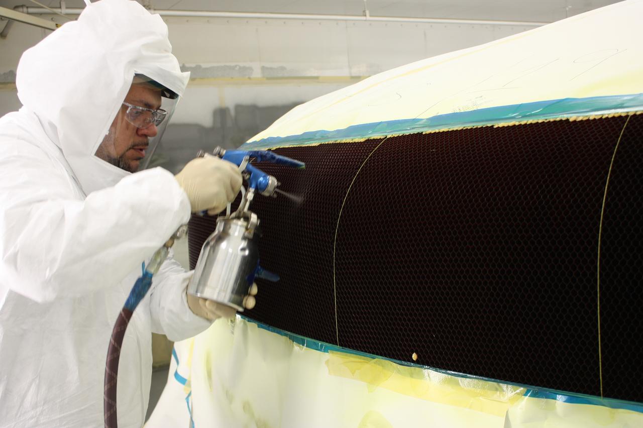 Technicians at Textron in Wimington, MA, work on the Exploration Flight Test-1 (EFT-1) Orion heat shield carrier structure on May 8, 2013. Part of Batch image transfer from Flickr.