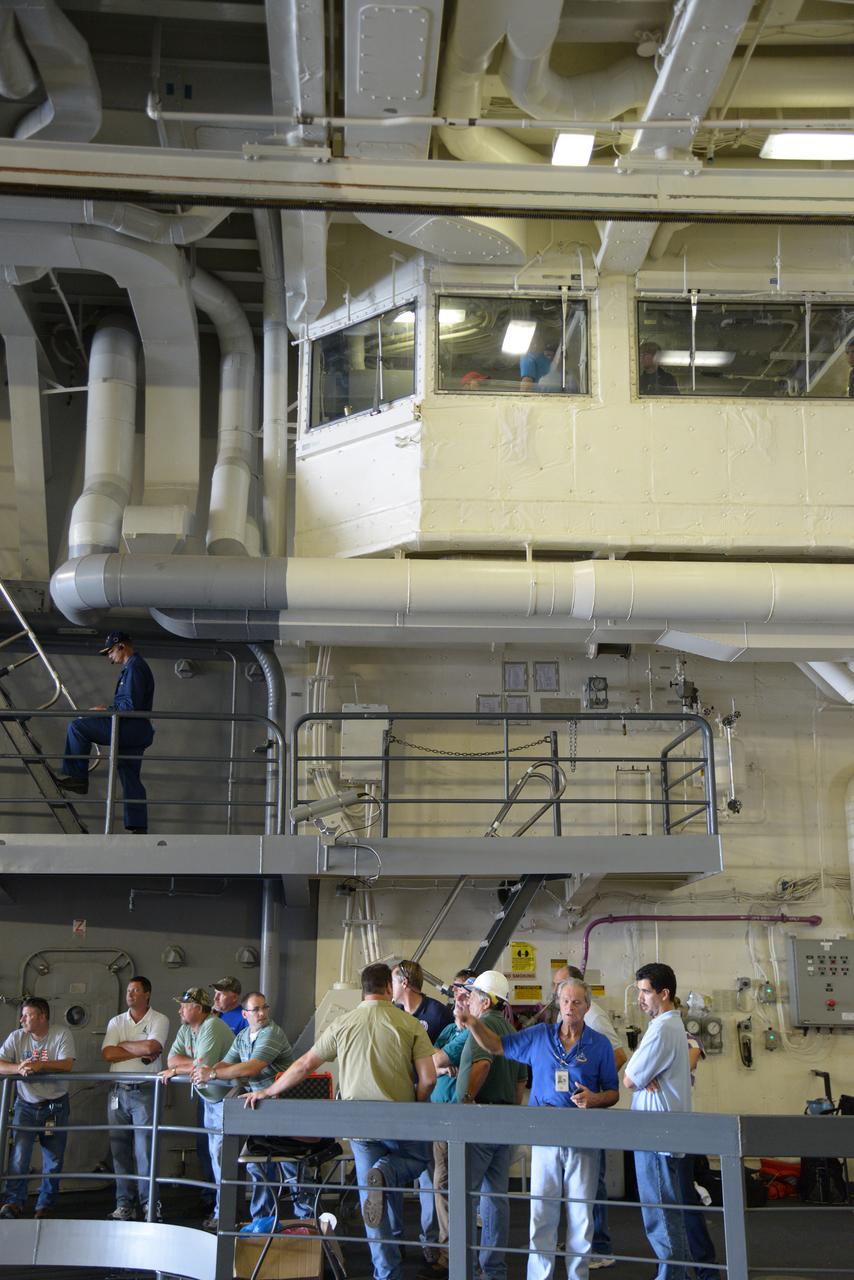 The Orion test capsule undergoes stationary recovery testing in Norfolk, VA on Aug. 13, 2013. NASA and the U.S Navy led the tests using the USS Arlington...The stationary recovery tests allow the teams to demonstrate and evaluate the recovery processes, the hardware and the test personnel in a controlled environment. ..During the test, the U.S Navy Dive Team checked the capsule for hazards while sailors from the USS Arlington approached the capsule in inflatable boats, and towed it back to the ship’s flooded well deck.  Part of Batch image transfer from Flickr.