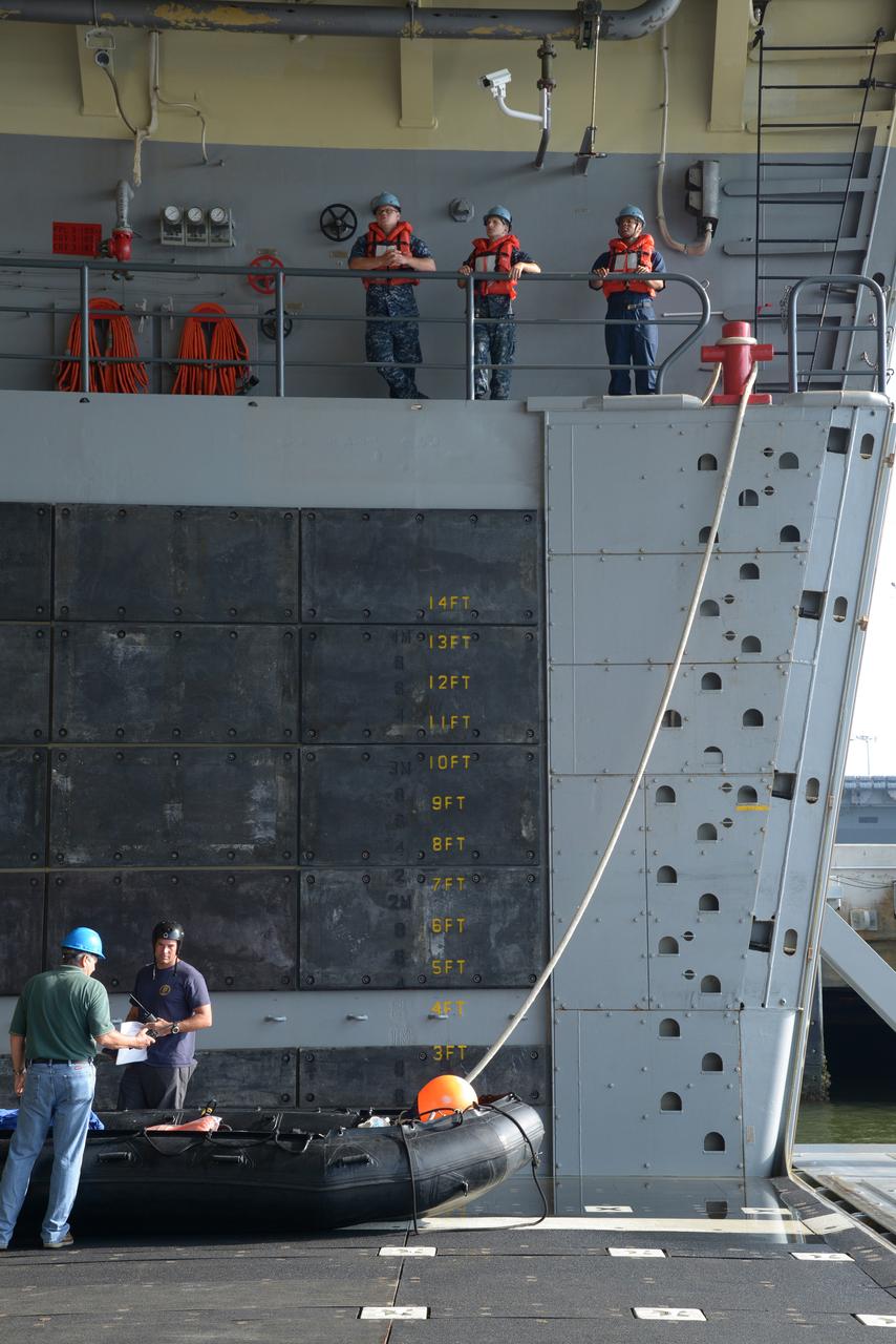The Orion test capsule undergoes stationary recovery testing in Norfolk, VA on Aug. 13, 2013. NASA and the U.S Navy led the tests using the USS Arlington...The stationary recovery tests allow the teams to demonstrate and evaluate the recovery processes, the hardware and the test personnel in a controlled environment. ..During the test, the U.S Navy Dive Team checked the capsule for hazards while sailors from the USS Arlington approached the capsule in inflatable boats, and towed it back to the ship’s flooded well deck.  Part of Batch image transfer from Flickr.