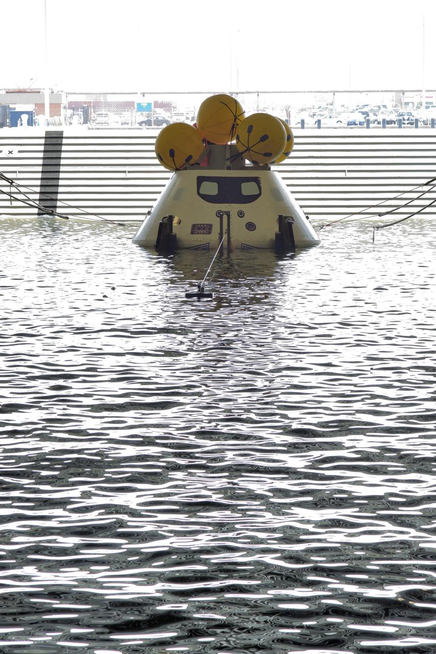 The Orion test capsule undergoes stationary recovery testing in Norfolk, VA on Aug. 13, 2013. NASA and the U.S Navy led the tests using the USS Arlington...The stationary recovery tests allow the teams to demonstrate and evaluate the recovery processes, the hardware and the test personnel in a controlled environment. ..During the test, the U.S Navy Dive Team checked the capsule for hazards while sailors from the USS Arlington approached the capsule in inflatable boats, and towed it back to the ship’s flooded well deck.  Part of Batch image transfer from Flickr.