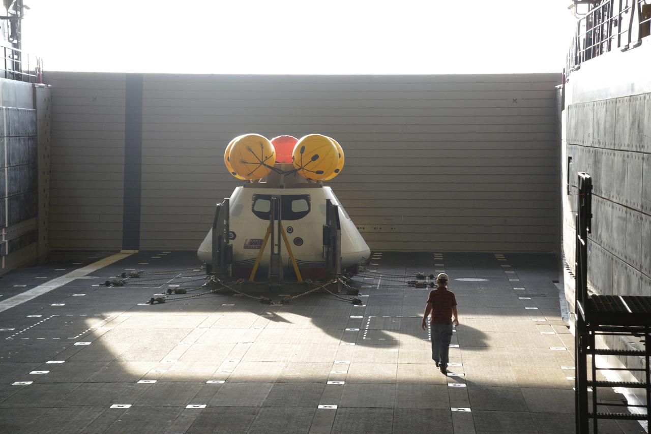 The Orion test capsule undergoes stationary recovery testing in Norfolk, VA on Aug. 13, 2013. NASA and the U.S Navy led the tests using the USS Arlington...The stationary recovery tests allow the teams to demonstrate and evaluate the recovery processes, the hardware and the test personnel in a controlled environment. ..During the test, the U.S Navy Dive Team checked the capsule for hazards while sailors from the USS Arlington approached the capsule in inflatable boats, and towed it back to the ship’s flooded well deck.  Part of Batch image transfer from Flickr.
