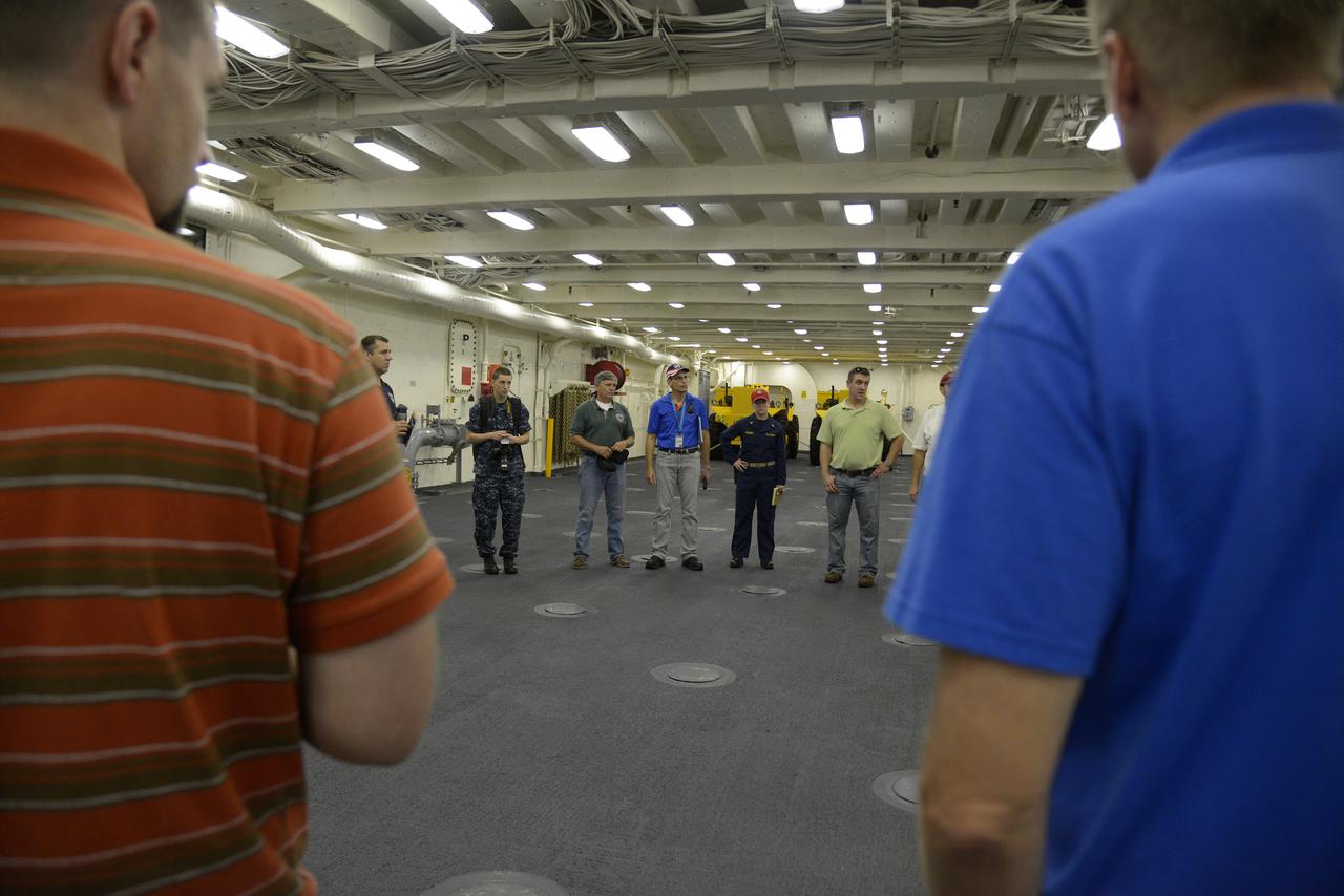 The Orion test capsule undergoes stationary recovery testing in Norfolk, VA on Aug. 13, 2013. NASA and the U.S Navy led the tests using the USS Arlington...The stationary recovery tests allow the teams to demonstrate and evaluate the recovery processes, the hardware and the test personnel in a controlled environment. ..During the test, the U.S Navy Dive Team checked the capsule for hazards while sailors from the USS Arlington approached the capsule in inflatable boats, and towed it back to the ship’s flooded well deck.  Part of Batch image transfer from Flickr.