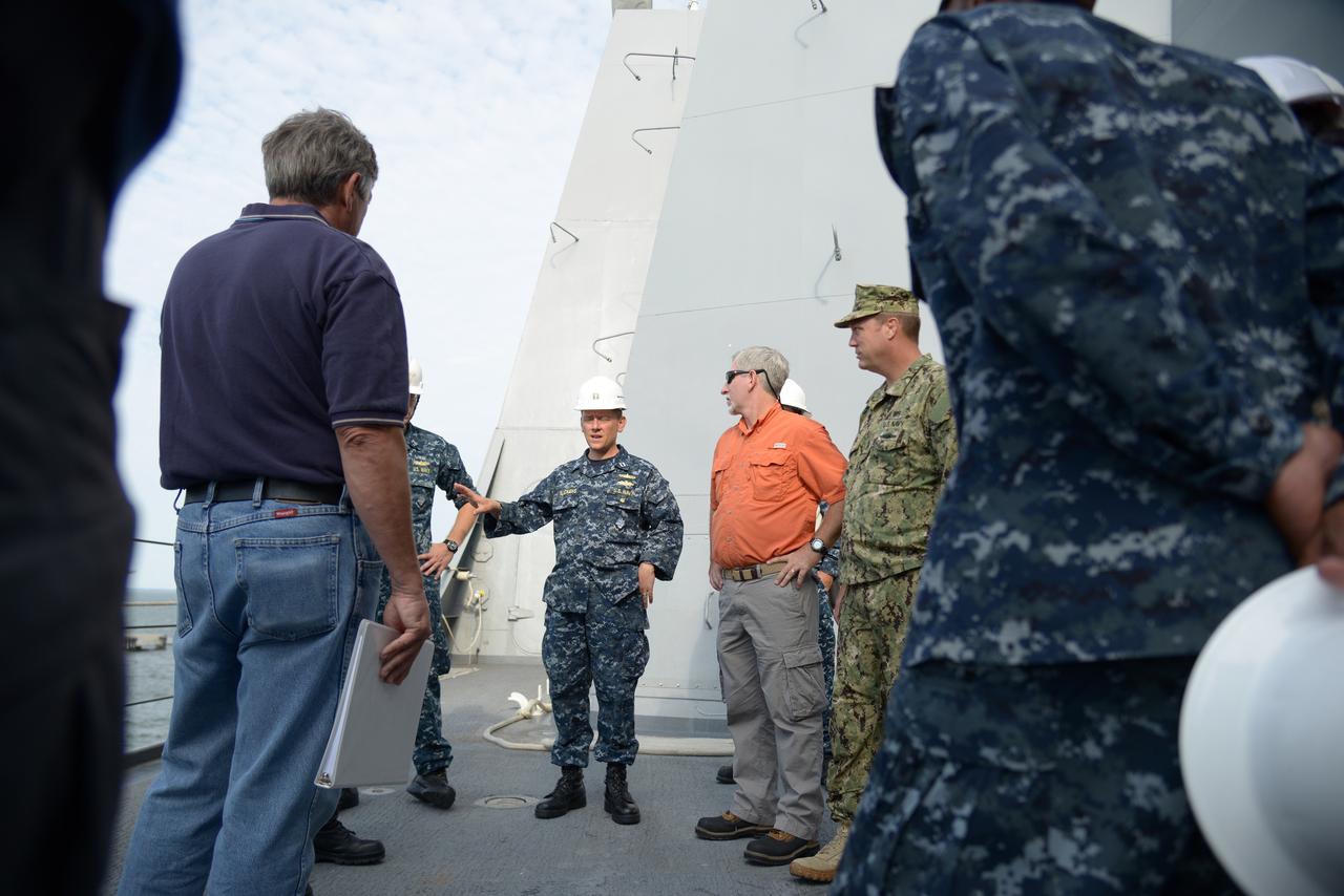 The Orion test capsule undergoes stationary recovery testing in Norfolk, VA on Aug. 13, 2013. NASA and the U.S Navy led the tests using the USS Arlington...The stationary recovery tests allow the teams to demonstrate and evaluate the recovery processes, the hardware and the test personnel in a controlled environment. ..During the test, the U.S Navy Dive Team checked the capsule for hazards while sailors from the USS Arlington approached the capsule in inflatable boats, and towed it back to the ship’s flooded well deck.  Part of Batch image transfer from Flickr.