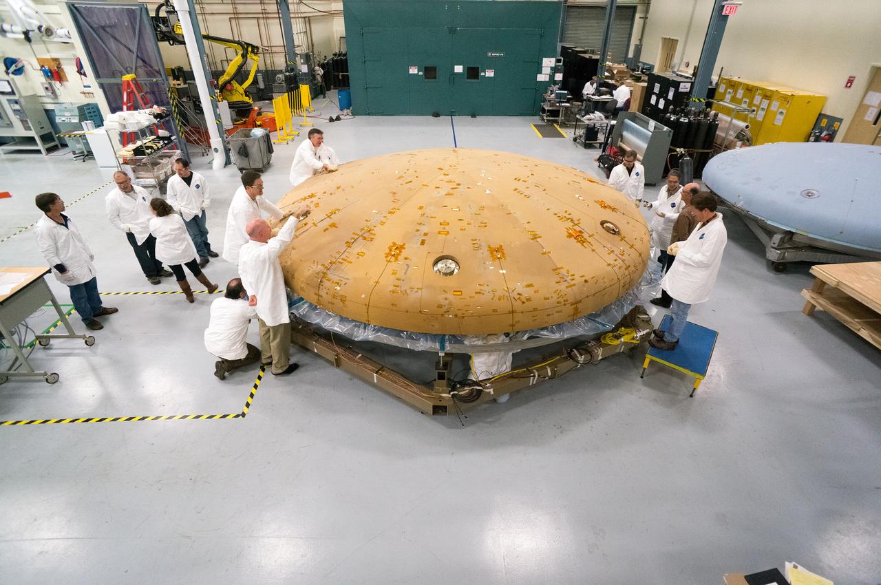 Technicians at Textron in Wimington, MA, inspect the Exploration Flight Test-1 (EFT-1) Orion heat shield after a cold soak test on Nov. 22, 2013. Part of Batch image transfer from Flickr.