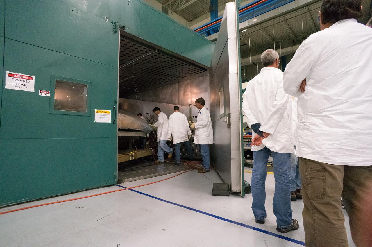 Technicians at Textron in Wimington, MA, inspect the Exploration Flight Test-1 (EFT-1) Orion heat shield after a cold soak test on Nov. 22, 2013. Part of Batch image transfer from Flickr.