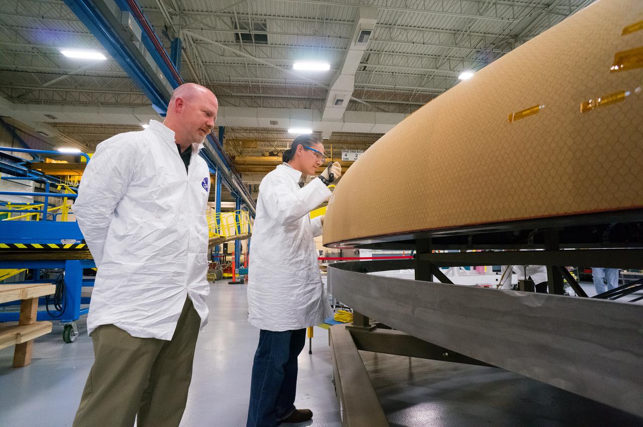 Technicians at Textron in Wimington, MA, inspect the Exploration Flight Test-1 (EFT-1) Orion heat shield after a cold soak test on Nov. 22, 2013. Part of Batch image transfer from Flickr.