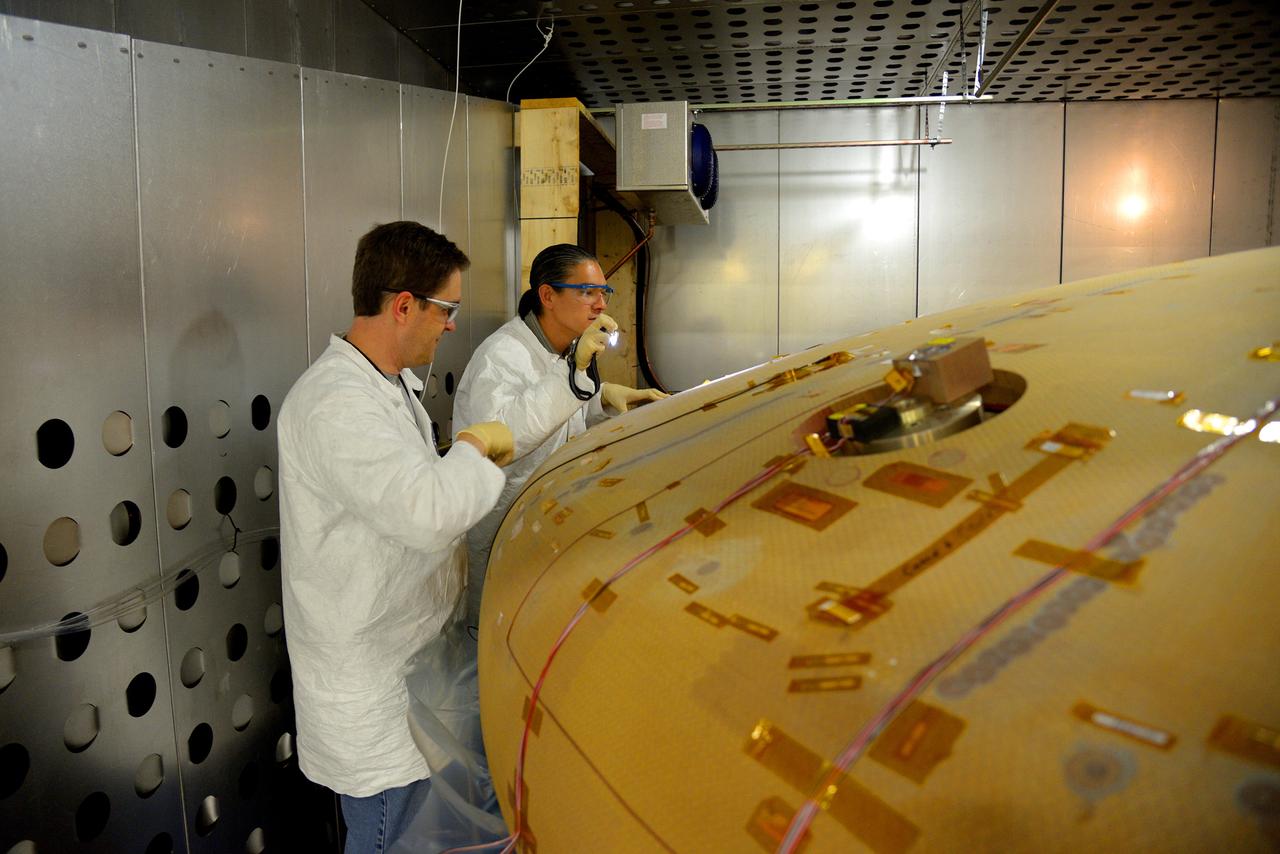 Technicians at Textron in Wimington, MA, inspect the Exploration Flight Test-1 (EFT-1) Orion heat shield after a cold soak test on Nov. 22, 2013. Part of Batch image transfer from Flickr.