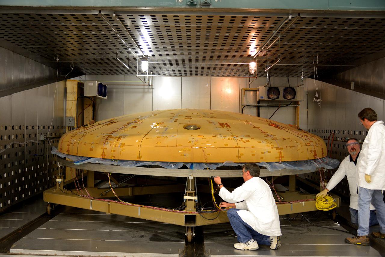 Technicians at Textron in Wimington, MA, inspect the Exploration Flight Test-1 (EFT-1) Orion heat shield after a cold soak test on Nov. 22, 2013. Part of Batch image transfer from Flickr.