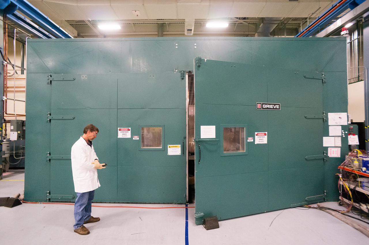 Technicians at Textron in Wimington, MA, inspect the Exploration Flight Test-1 (EFT-1) Orion heat shield after a cold soak test on Nov. 22, 2013. Part of Batch image transfer from Flickr.