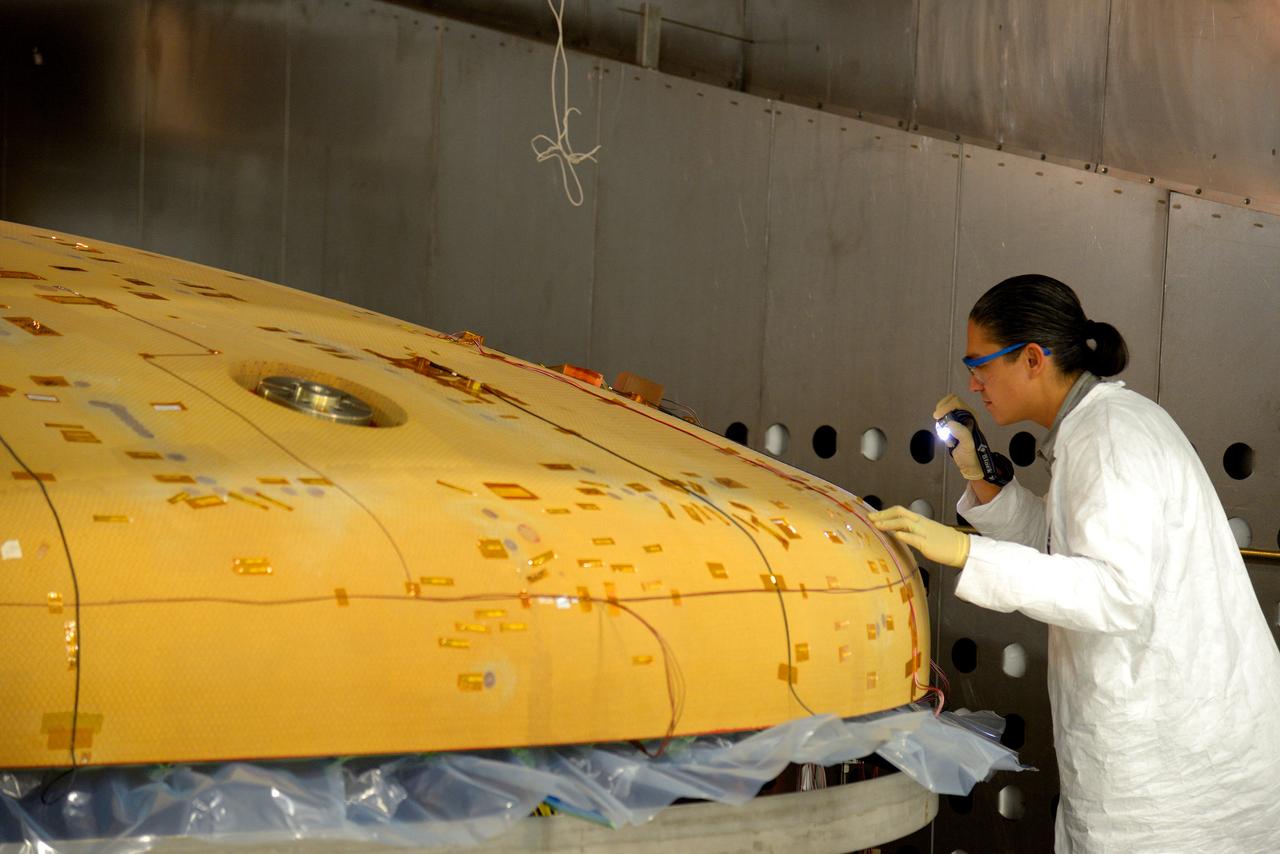 Technicians at Textron in Wimington, MA, inspect the Exploration Flight Test-1 (EFT-1) Orion heat shield after a cold soak test on Nov. 22, 2013. Part of Batch image transfer from Flickr.