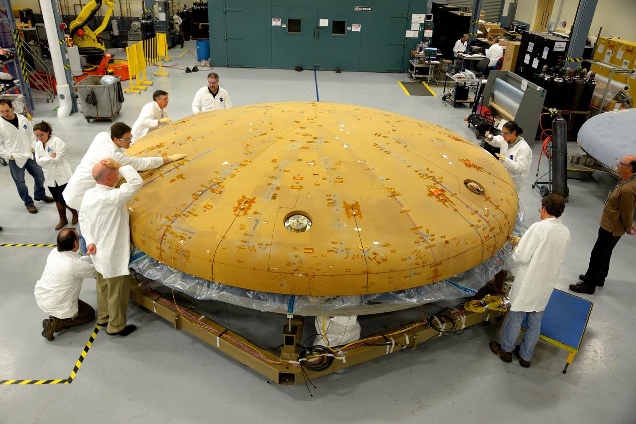 Technicians at Textron in Wimington, MA, inspect the Exploration Flight Test-1 (EFT-1) Orion heat shield after a cold soak test on Nov. 22, 2013. Part of Batch image transfer from Flickr.