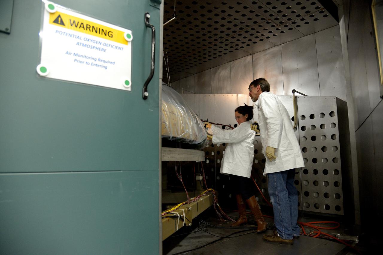 Technicians at Textron in Wimington, MA, inspect the Exploration Flight Test-1 (EFT-1) Orion heat shield after a cold soak test on Nov. 22, 2013. Part of Batch image transfer from Flickr.