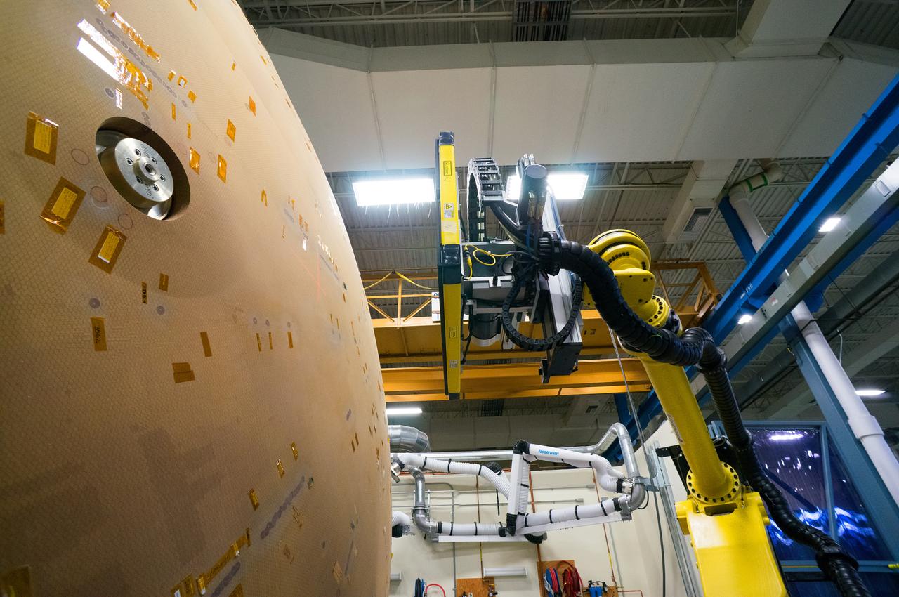 Technicians at Textron in Wimington, MA, perform X-ray testing on the Exploration Flight Test-1 (EFT-1) Orion heat shield on Nov. 23, 2013. Part of Batch image transfer from Flickr.