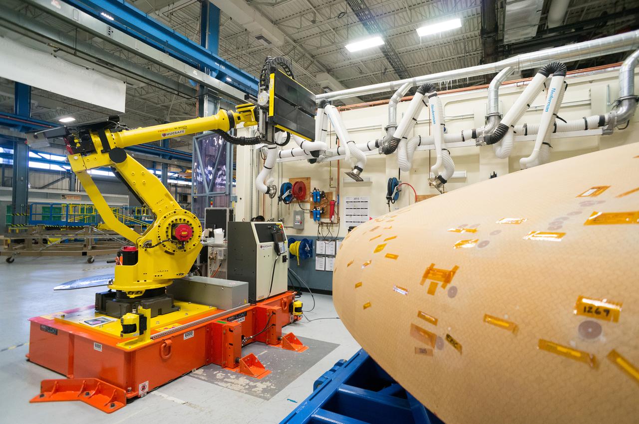 Technicians at Textron in Wimington, MA, perform X-ray testing on the Exploration Flight Test-1 (EFT-1) Orion heat shield on Nov. 23, 2013. Part of Batch image transfer from Flickr.