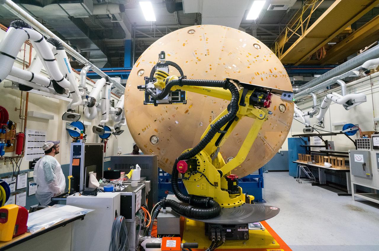 Technicians at Textron in Wimington, MA, perform X-ray testing on the Exploration Flight Test-1 (EFT-1) Orion heat shield on Nov. 23, 2013. Part of Batch image transfer from Flickr.