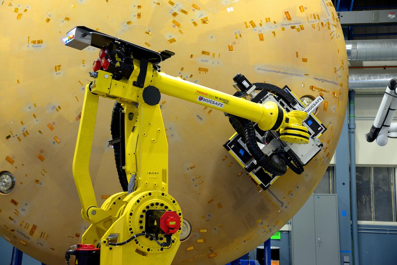 Technicians at Textron in Wimington, MA, perform X-ray testing on the Exploration Flight Test-1 (EFT-1) Orion heat shield on Nov. 23, 2013. Part of Batch image transfer from Flickr.