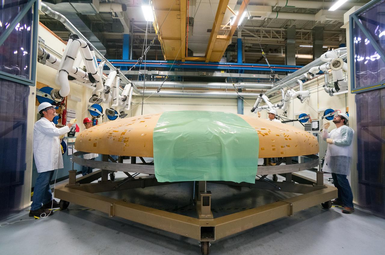 Technicians at Textron in Wimington, MA, perform X-ray testing on the Exploration Flight Test-1 (EFT-1) Orion heat shield on Nov. 23, 2013. Part of Batch image transfer from Flickr.