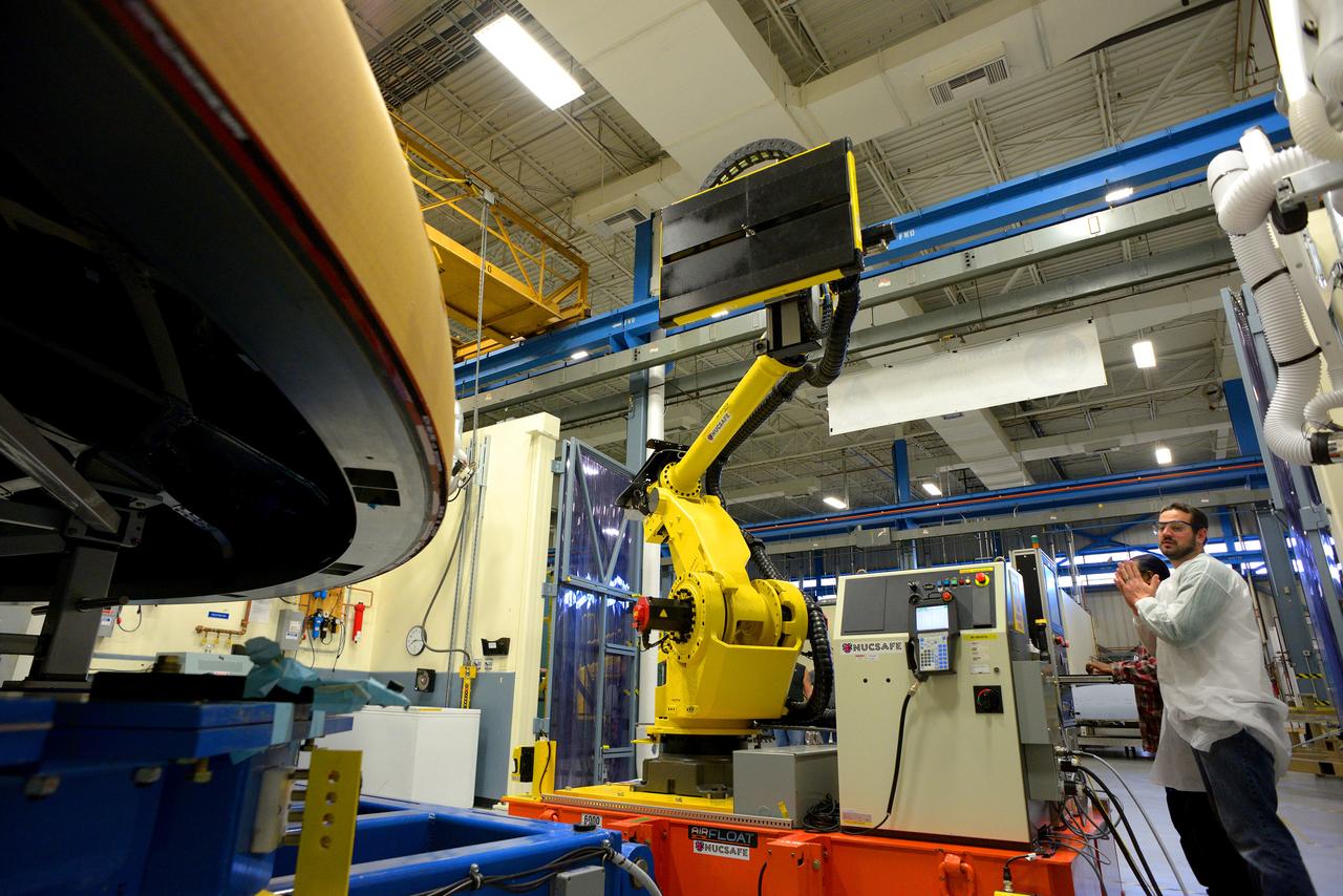 Technicians at Textron in Wimington, MA, perform X-ray testing on the Exploration Flight Test-1 (EFT-1) Orion heat shield on Nov. 23, 2013. Part of Batch image transfer from Flickr.