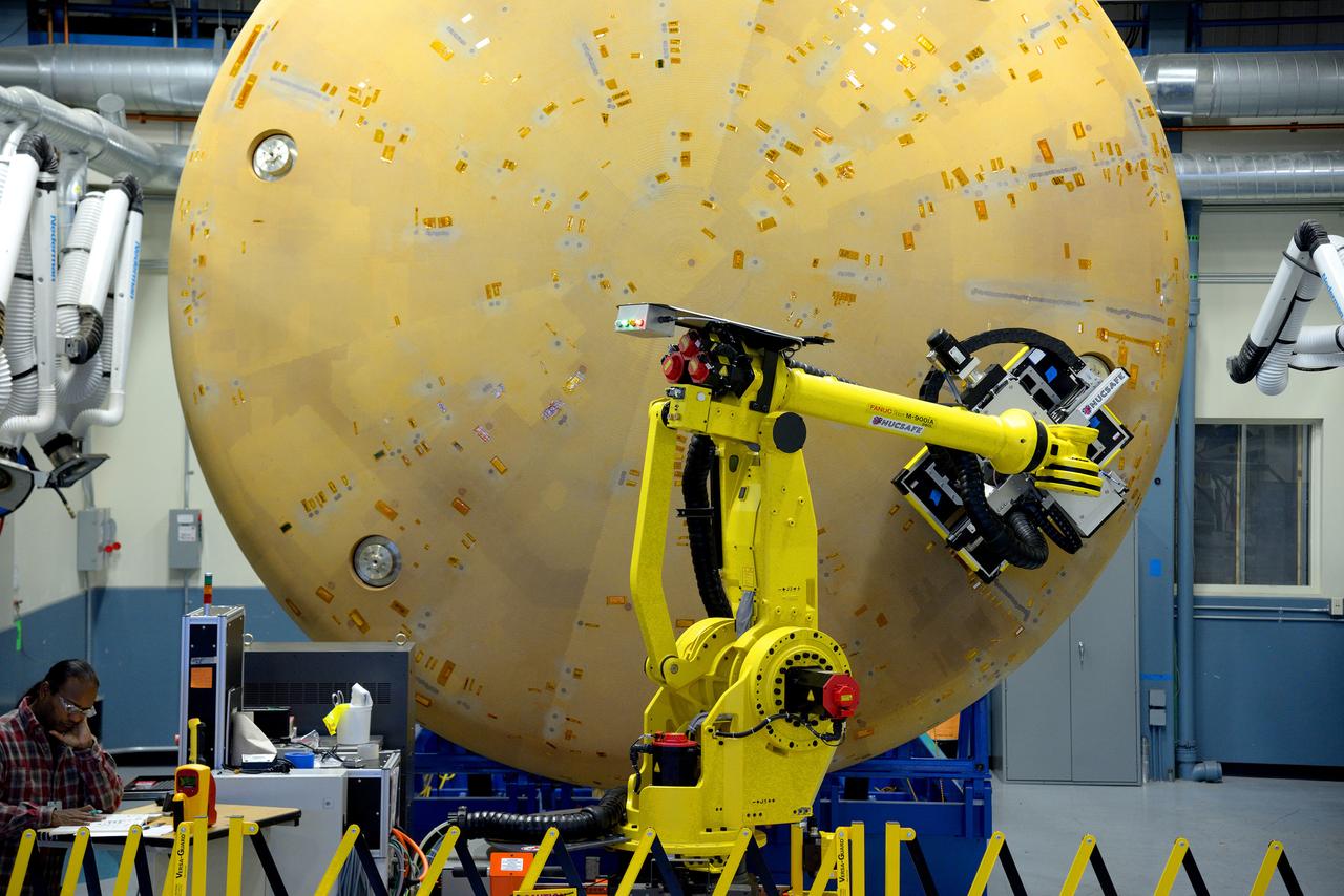 Technicians at Textron in Wimington, MA, perform X-ray testing on the Exploration Flight Test-1 (EFT-1) Orion heat shield on Nov. 23, 2013. Part of Batch image transfer from Flickr.